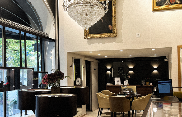 Luxurious interior of a high-end restaurant with modern decor and large windows.